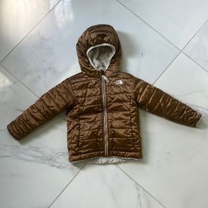 Gold reversible north face toddler jacket. Size 3T but fits more like a 4/5